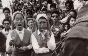 people power revolution on EDSA with nuns praying Rosary